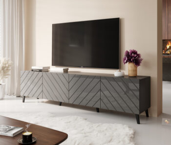 TV stolík ABETO 200 má elegantný a jedinečný dizajn, ktorý Vás očarí svojou výnimočnosťou. Farebné prevedenie grafit / grafit lesk dodáva interiéru štýlový a elegantný vzhľad, ktorý zaručene zaujme pohľady Vašich návštevníkov. Uzavreté skrinky Vám ponúkajú dostatok úložného priestoru pre dokumenty…