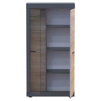 Dvojdverová vitrína Dolin CT v prevedení grafit / dub sonoma je moderným a praktickým kusom nábytku, ktorý sa hodí do každého interiéru. Jej tmavá farba dodáva priestoru eleganciu a štýl. Vitrína je vyrobená z aglomerovaného materiálu DTD, ktorý je známy svojou odolnosťou a dlhou životnosťou.