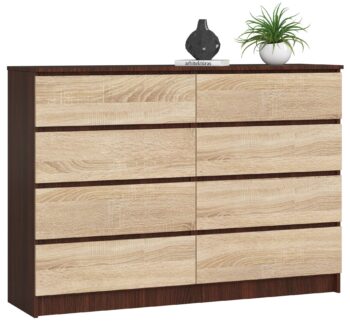 Komoda SAMUEL140: Elegancia wenge spojená s teplom duba Sonoma Chcete obohatiť svoj interiér o prvok, ktorý kombinuje tmavú mystiku wenge s prírodným charakterom duba Sonoma? Komoda SAMUEL140 presne spĺňa tieto požiadavky, a navyše ponúka kombináciu funkčnosti s dizajnovým prevedením.  Typ tovaru: Komoda, skrinka Materiál: Odolný a dlhoročný LTD Rozmer: 99 x 138 x 40 cm - priestranná, ale zároveň elegantne štíhla < li>Farba: Tmavé tóny wenge harmonicky doplnené svetlejším dubom Sonoma Vybavenie: 6 priestranných zásuviek a ďalšie úložné priestory < strong>Štýl: Moderné a dizajnové riešenie Vzhľad: Vysoký dizajn, ktorý opticky zväčší priestor  SAMUEL140  sa dokonale hodí do každej spálne či obývacej izby, kde sa stane nielen užitočným úložným miestom, ale aj štýlovým doplnkom interiéru. Dajte svojim veciam domov v dizajne, ktorý nikdy nevyjde z módy.