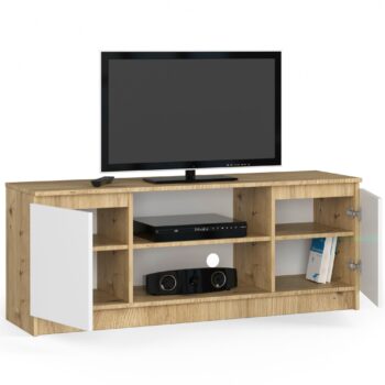 TV stolík ROMANA140: Elegancia dreva dub artisan kombinovaná s čistou bielou TV stolík ROMANA140 kombinuje eleganciu odtieňa duba artisan s čistou bielou farbou, čo ho robí dokonalým doplnkom pre moderné obývacie izby. Jeho dizajnový a zároveň praktický dizajn spĺňa očakávania aj tých najnáročnejších užívateľov.  Typ tovaru: TV stolík Materiál: LTD Rozmery: 55 x 140 x 40 cm Farba: dub artisan + biela Vybavenie: dvierka plné (skrinka) Štýl: moderné, dizajnové Počet políc: 2  Stolček ROMANA140 nielenže esteticky obohatí vaše obytné priestory, ale vďaka plným dvierkam a dvom praktickým policam ponúkne dostatok úložného priestoru pre televízne prístroje, ovládače a ďalšie doplnky.
