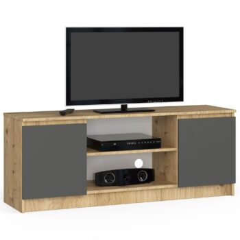 TV stolík ROMANA140: Spojenie dreva dub Artisan a moderného grafitom TV stolík ROMANA140 predstavuje dokonalú harmóniu medzi tradičným vzhľadom dreva dub Artisan a moderným grafitom. Tento dizajnový kúsok sa skvele hodí do každej obývačky, ktorá si zakladá na modernom štýle s nádychom klasiky.  Typ tovaru: TV stolík  Materiál: LTD Rozmery: 55 x 140 x 40 cm Farba: dub Artisan + grafit Vybavenie: dvierka plné (skrinka) Štýl: moderné, dizajnové < strong>Počet políc: 2  Stolček ROMANA140 ponúka nielen štýlový vzhľad, ale aj praktické dvierka a dve police pre úložný priestor. Ideálne pre tých, ktorí hľadajú kombináciu funkčnosti a estetiky v jednom produkte.