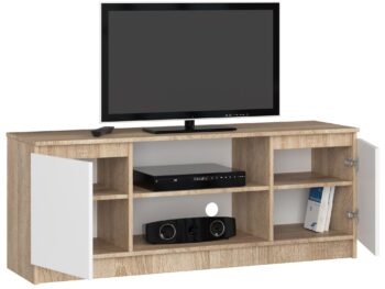 TV stolík ROMANA140: Moderná kombinácia duba Sonoma a bielej farby Výnimočný TV stolík ROMANA140 prináša svieži vzhľad do každej obývačky vďaka dokonalej kombinácii duba Sonoma a čistej bielej. Jeho moderný dizajn je zárukou, že sa stane stredobodom vašej miestnosti.  Typ tovaru: TV stolík Materiál: LTD Rozmery: 55 x 140 x 40 cm Farba: dub Sonoma + biela Vybavenie: dvierka plné (skrinka) Štýl: moderné, dizajnové Počet políc: 2  ROMANA140 nie je len o estetike. Okrem svojho nádherného designu ponúka aj praktické úložné priestory vďaka svojim dvierkam a dvom políciam. Ideálne riešenie pre všetky vaše multimediálne zariadenia.