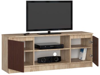 TV stolík ROMANA140: Elegantná kombinácia duba Sonoma a wenge Objavte modernú krásu s TV stolom ROMANA140. Prirodzený vzhľad duba Sonoma v kombinácii s hlbokým tónom wenge dodáva tomuto stolíku jedinečný a súčasný charakter, ktorý sa dokonale hodí do každej obývačky.  Typ tovaru: TV stolík< /li> Materiál: LTD Rozmery: 55 x 140 x 40 cm Farba:  dub Sonoma + wenge Vybavenie: dvierka plné (skrinka) Štýl: moderné, dizajnové Počet políc: 2  ROMANA140 nielenže zaujme svojím dizajnom, ale tiež skvele splní svoju funkciu. Vďaka dvierkam a dvom políciam ponúka dostatok miesta na uloženie všetkých vašich mediálnych zariadení a doplnkov.