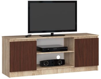 TV stolík ROMANA140: Elegantná kombinácia duba Sonoma a wenge Objavte modernú krásu s TV stolom ROMANA140. Prirodzený vzhľad duba Sonoma v kombinácii s hlbokým tónom wenge dodáva tomuto stolíku jedinečný a súčasný charakter, ktorý sa dokonale hodí do každej obývačky.  Typ tovaru: TV stolík< /li> Materiál: LTD Rozmery: 55 x 140 x 40 cm Farba:  dub Sonoma + wenge Vybavenie: dvierka plné (skrinka) Štýl: moderné, dizajnové Počet políc: 2  ROMANA140 nielenže zaujme svojím dizajnom, ale tiež skvele splní svoju funkciu. Vďaka dvierkam a dvom políciam ponúka dostatok miesta na uloženie všetkých vašich mediálnych zariadení a doplnkov.
