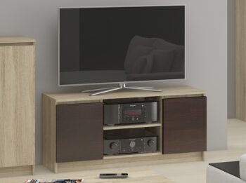 TV stolík ROMANA140: Elegantná kombinácia duba Sonoma a wenge Objavte modernú krásu s TV stolom ROMANA140. Prirodzený vzhľad duba Sonoma v kombinácii s hlbokým tónom wenge dodáva tomuto stolíku jedinečný a súčasný charakter, ktorý sa dokonale hodí do každej obývačky.  Typ tovaru: TV stolík< /li> Materiál: LTD Rozmery: 55 x 140 x 40 cm Farba:  dub Sonoma + wenge Vybavenie: dvierka plné (skrinka) Štýl: moderné, dizajnové Počet políc: 2  ROMANA140 nielenže zaujme svojím dizajnom, ale tiež skvele splní svoju funkciu. Vďaka dvierkam a dvom políciam ponúka dostatok miesta na uloženie všetkých vašich mediálnych zariadení a doplnkov.