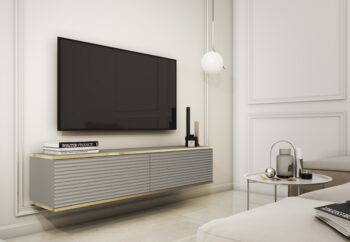 Moderný TV stolík ORLANDO sa stane pýchou každej obývačky. Zavesením na stenu v miestnosti pôsobí vzdušne a nadčasovo. Pre produkt boli použité módne farby a odolné materiály. Je vybavený dvoma priehradkami, ktoré poskytujú priestor pre rôzne typy elektronických zariadení a ďalšie príslušenstvo. Tiché a jemné otváranie dvierok zabezpečí push to open systém, stačí len zľahka zatlačiť na čelo nábytku. Zaujímavé drážkované predné čelá so zlatým lemovaním tento produkt odlišujú od ostatných TV stolíkov a v miestnosti tak pôsobí luxusne a štýlovo. Farebné prevedenie: 4 farby na výberMateriál: MDF doska vystužená ABS hranouROZMERY: Hĺbka: 32 cmŠírka: 135 cmVýška: 30 cmDodávame v demonte.  