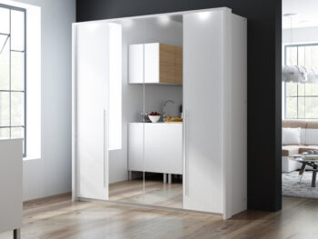 Moderná šatníková skriňa REMA 210 je unikátny nábytok v elegantnom prevedení.  Táto skriňa má výnimočné a netypické otváranie dverí (viď. obrázok) s využitím väčších nenápadných rukovätí v striebornej farbe. Zalomenie dverí využíva kvalitné kovanie HETTICH.Stabilná konštrukcia tvorí základ skrine. Dvere sú členené a  vyrobené z 4 častí. Stredové 2 časti majú zrkadlo. Skriňa je doplnená efektným osvetlením, ktoré je zahrnuté v cene.Skriňa REMA 210 je vyrobená v modernom dizajnovom prevedení v žiadanej bielej farbe.  Svoje využitie nájde v spálni aj  inej miestnosti.  Ponúka dostatočný priestor na uloženie Vášho oblečenia. Úložný priestor je členený na poličkový a vešiakový. Po bokoch skrine sú z každej strany  4 poličky. Stredová časť obsahuje 2 vešiakové tyče.Skriňa je vyrobená z kvalitnej LTD dosky.Rozmery (š/v/h): 209 x 219 x 65 cmDodávame v demonte.