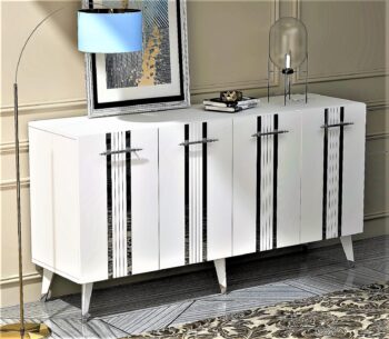 Skrinka ROBERT – Luxusné a priestranné úložné riešenie pre obývaciu izbuSkrinka ROBERT prináša do vašej obývačky kombináciu luxusu a funkčnosti. Jej široký dizajn a elegantné spojenie antracitovej a zlatej farby dodáva interiéru sofistikovaný vzhľad. So štyrmi plnými dvierkami poskytuje dostatok priestoru na usporiadanie vašich vecí, či už ide o knihy, dekorácie alebo iné predmety.S rozmermi 80 x 150 x 40 cm je skrinka ROBERT nielen priestranná, ale aj praktická. Vyrobená z kvalitného LTD materiálu s hrúbkou 18 mm, zaisťuje pevnosť a odolnosť. Plastové úchytky a plastové nožičky dopĺňajú jej moderný vzhľad a zaisťujú stabilitu.Hlavné vlastnosti:Materiál: LTDRozmer: 80 x 150 x 40 cmVybavenie: Dvierka plné (skrinka)Štýl: LuxusnéVzhľad: ŠirokáPočet dverí, dvierok: 4 dverovéÚchytky: PlastovéHrúbka materiálu: 18 mmDodatočné informácie: Dodávame v demonte, plastové nožičkyFarba: Biela / striebornáSkrinka ROBERT je dodávaná v demontovanom stave s priloženým návodom na jednoduchú montáž. Vďaka plastovým nožičkám je stabilný a zároveň chráni podlahu pred poškriabaním. Tento luxusný kus nábytku je perfektnou voľbou pre tých, ktorí hľadajú elegantné a priestranné úložné riešenie pre svoju obývačku.