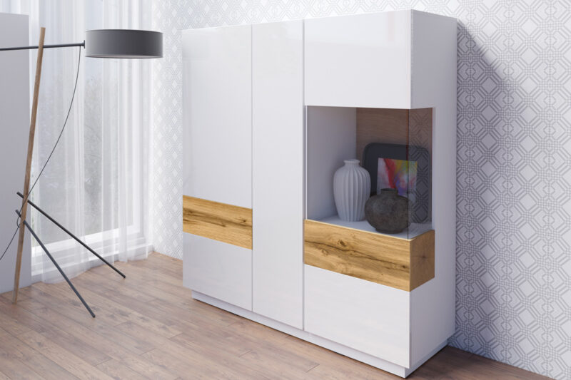 SELINKA 46 trojdverová vitrína, biely lesk / dub Wotan SELINKA je vitrína v modernom prevedení. Patrí k nábytku SELINKA, ktorý je charakteristický svojim kvalitným prevedením a praktickým riešením. Oceníte aj efektné prevedenie a celkový dizajn. Zaujímavé prepojenie dvoch farieb zvýrazňuje jedinečnosť tohto nábytku. Vďaka viacerým farebným kombináciám si z tejto kolekcie vyberie každý.Korpus nábytku je vyrobený z LTD dosky. Dvierka sú z MDF dosky, potiahnutej kvalitnou membránovou fóliou. Tento materiál je nenáročný na údržbu. Vitrína je trojdverová. Dvoje dvere sú plné, jedny presklené.Dvierka sú bezúchytové, využívajú systém push to open.Rozmery(š/v/h): 130/139/40 cm.Dodávame v demontovanom stave.