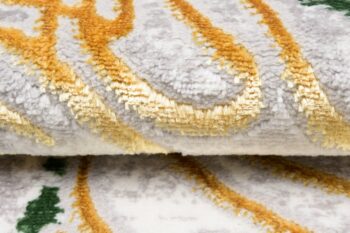 Trendový krémovo-zelený koberec so vzorom zlatých listov Šírka: 120 cm | Dĺžka: 170 cm