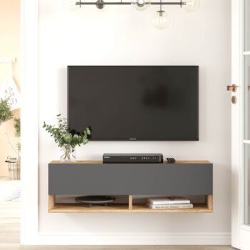 FREY 13: Elegantný stolík TV kombinujúci borovicu a šedú Hľadáte nábytok, ktorý by priniesol do vášho interiéru štýl a zároveň bol funkčný? FREY 13 je televízny stolík, ktorý spája moderný dizajn s praktickými prvkami. Tento stolík v kombinácii odtieňov borovice a šedej sa stane skvelým doplnkom pre vašu obývaciu izbu, kanceláriu či pracovňu.  Typ tovaru: stolík TV, dokonale doplní vaše moderné priestory.  Materiál: kvalitný a odolný LTD s hrúbkou 18 mm, zaručuje dlhú životnosť. Rozmery: 100 x 31,6 x 29,6 cm - ideálny rozmer pre rôzne veľkosti miestností. Farba: kombinácia prírodnej borovice a antracitu. Vybavenie: stolík ponúka plné dvierka (skrinka) a praktické odkladacie police. Štýl: moderné a dizajnové prevedenie, ktoré ocení každý milovník trendov.  Tvar: obdĺžnikový a rovný dizajn sa skvele hodí do každej miestnosti.  FREY 13 je viac než len televízny stolík. Je to spojenie funkčnosti a dizajnu, ktorý prinesie do vášho domova svieži a moderný vzhľad.