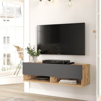 FREY 13: Elegantný stolík TV kombinujúci borovicu a šedú Hľadáte nábytok, ktorý by priniesol do vášho interiéru štýl a zároveň bol funkčný? FREY 13 je televízny stolík, ktorý spája moderný dizajn s praktickými prvkami. Tento stolík v kombinácii odtieňov borovice a šedej sa stane skvelým doplnkom pre vašu obývaciu izbu, kanceláriu či pracovňu.  Typ tovaru: stolík TV, dokonale doplní vaše moderné priestory.  Materiál: kvalitný a odolný LTD s hrúbkou 18 mm, zaručuje dlhú životnosť. Rozmery: 100 x 31,6 x 29,6 cm - ideálny rozmer pre rôzne veľkosti miestností. Farba: kombinácia prírodnej borovice a antracitu. Vybavenie: stolík ponúka plné dvierka (skrinka) a praktické odkladacie police. Štýl: moderné a dizajnové prevedenie, ktoré ocení každý milovník trendov.  Tvar: obdĺžnikový a rovný dizajn sa skvele hodí do každej miestnosti.  FREY 13 je viac než len televízny stolík. Je to spojenie funkčnosti a dizajnu, ktorý prinesie do vášho domova svieži a moderný vzhľad.