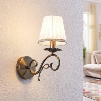 Nástenné svietidlo Lindby Finnick, farba starožitná mosadz, 34 cm, E14